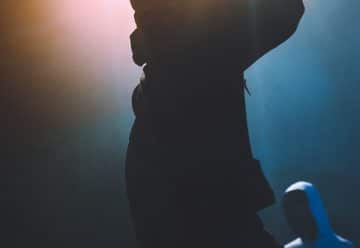 silhouette of man holding camera